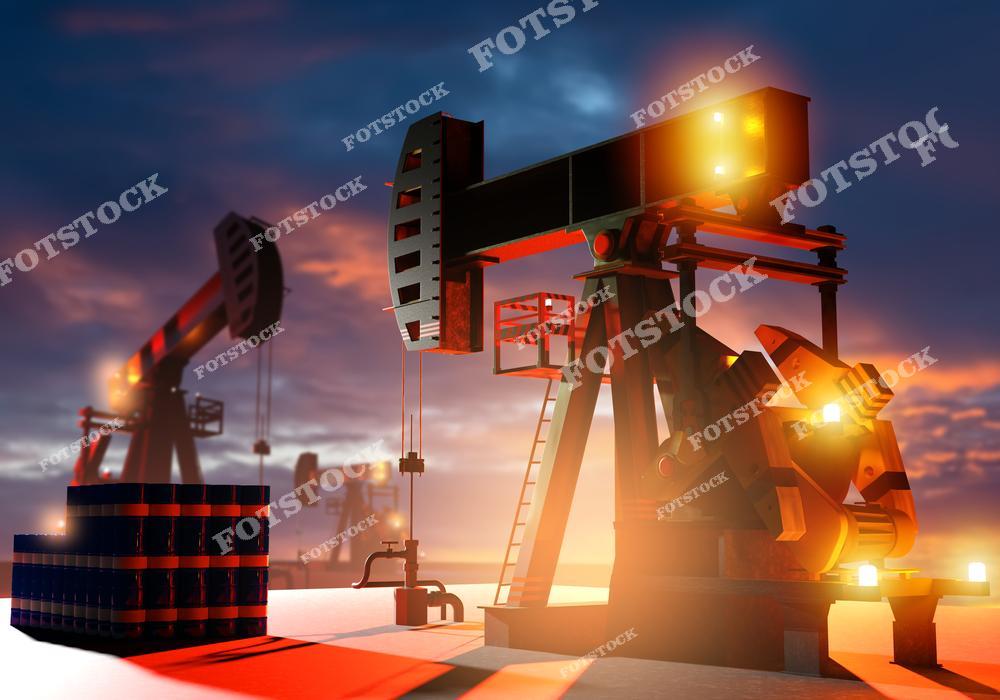 Изображение нефтяных качалок, работающих на фоне красочного заката, рядом с резервуарами для хранения нефти. Фотография символизирует процесс добычи и накопления топлива, подчеркивая значимость энергетического сектора и запасов нефти.
